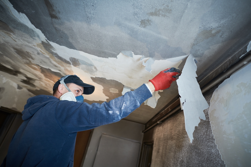 Semper Fi worker removes damaged ceiling in Yuma, AZ