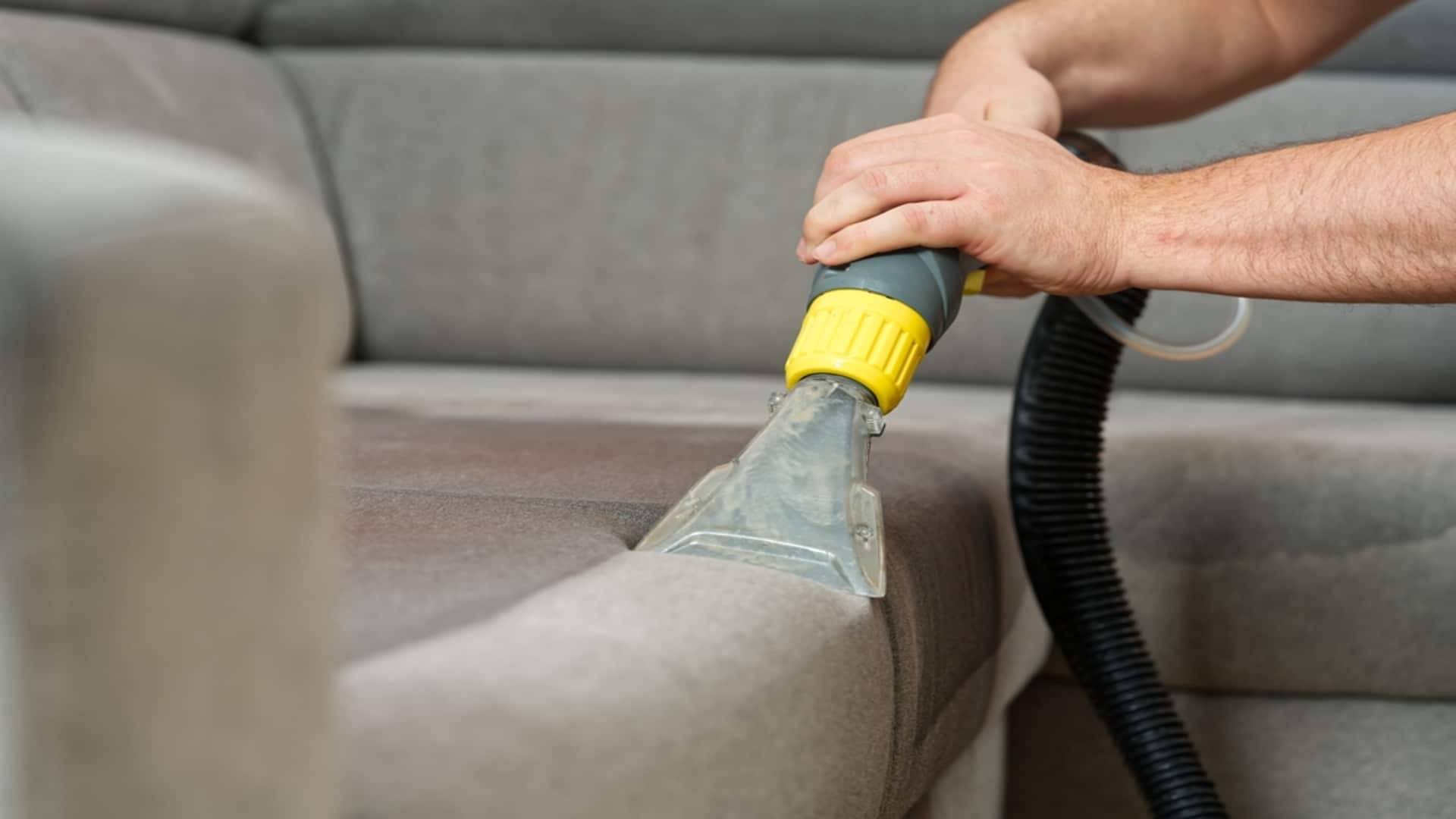 Deep cleaning a couch.