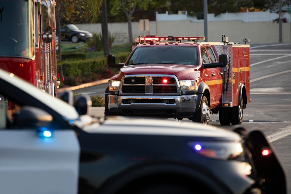 Police, fire, and paramedic units responding to an emergency scene.